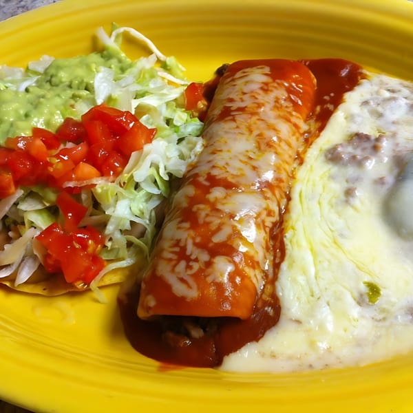 Don Jose Mexican Restaurant's burrito with red sauce, melted cheese, guacamole, lettuce, and diced tomatoes.